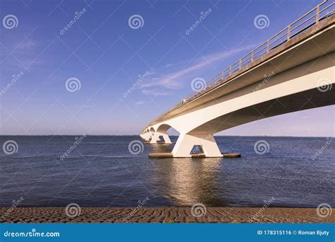 The Beautiful Zeeland Bridge Runs Above the Sea into the Distance. Stock Photo - Image of orange ...