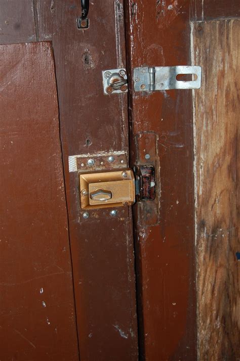 What style of lock for swinging garage doors that shift with the ...