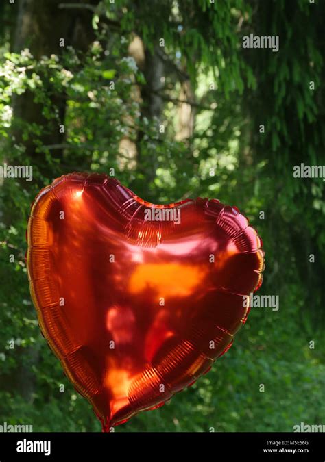 red heart balloon Stock Photo - Alamy
