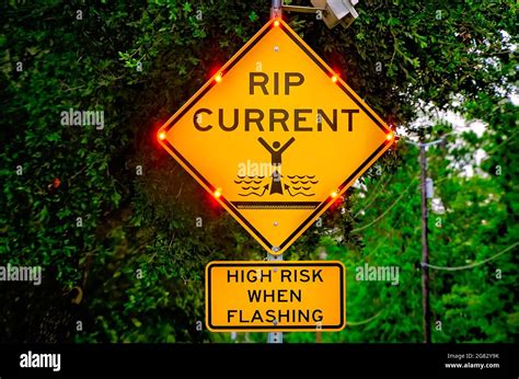 Rip current caution sign hi-res stock photography and images - Alamy