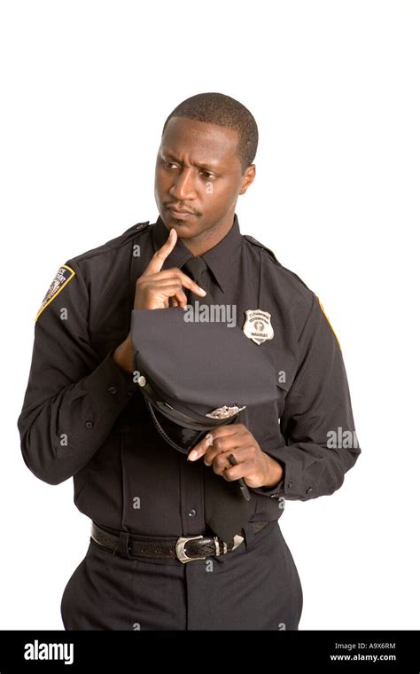 Young black American cop thinking carefully Stock Photo - Alamy