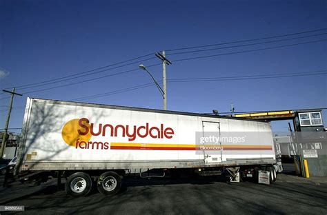 A truck pulls into the front gate at the Sunnydale Farms milk plant...