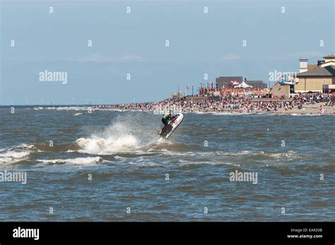 Rhyl Air Show August 31st 2014 showing sky tower and Rhyl beach with spectators and a jet skier ...