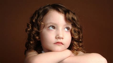 Cute Baby Girl Is Looking Up With Sad Face In Brown Background HD Cute Wallpapers | HD ...