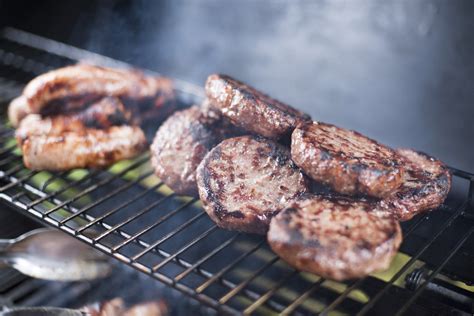 Free Stock Photo 17231 Beef burger patties and sausage on a BBQ | freeimageslive