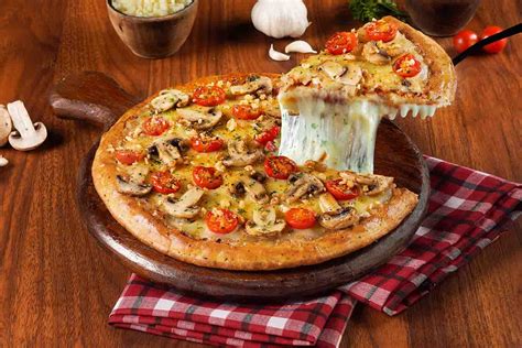 Order Roasted Garlic And Mushroom Cheese Burst Pizza Medium online from Ovenstory