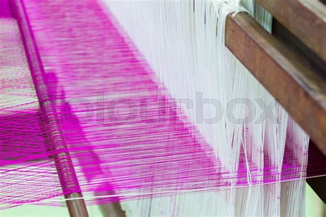 Silk weaving | Stock image | Colourbox