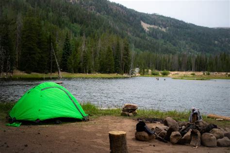 Green Tent Camping Next To Lake Stock Photo - Image of clothes, realistic: 121226804