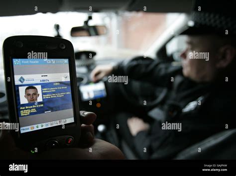 A Strathclyde Police officer using a new integrated computer system ...