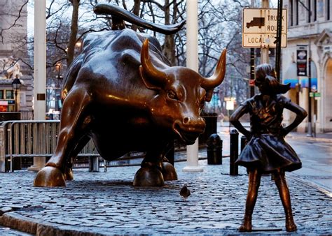 A bronze little girl sculpture joins the Charging Bull on Wall Street ...