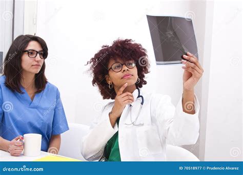 Doctor working in hospital stock image. Image of review - 70518977