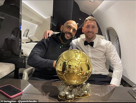 Lionel Messi and his ex-Navy SEAL bodyguard pose with the Ballon d'Or on a private jet as the ...