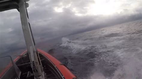 Watch: Dramatic video shows Coast Guard crew leap on to submarine in ...