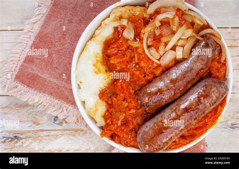 Traditional South African Pap and Wors, sausage with popular maize meal staple covered with ...