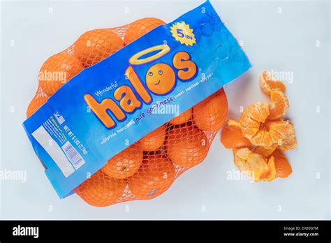 June 19, 2021. New York. Halos fresh tangerine in bag on white background. Top view Stock Photo ...