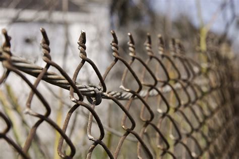 Fence | A rusty chain link fence containing a construction a… | Flickr