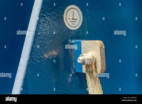 A ground screw with cable lug on an metal bar in an industrial plant Stock Photo - Alamy