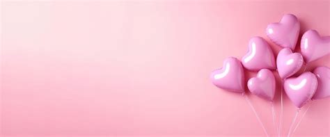 Premium AI Image | Heart shaped pink helium balloons on a pink background