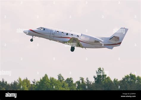 Small commercial airplane taking off Stock Photo - Alamy