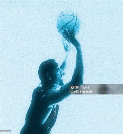 Basketball Player Shooting Ball High-Res Stock Photo - Getty Images