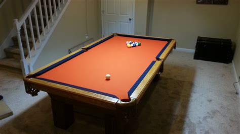 Used pool table assembly with Denver Broncos pool table cloth in Windsor Colorado.