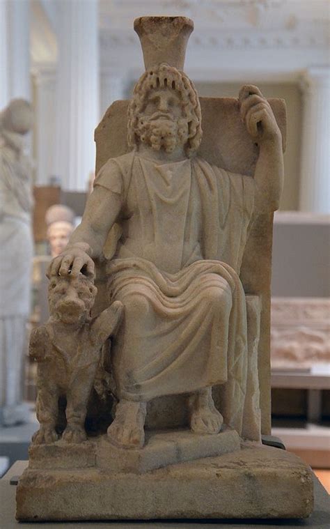 Marble statue of Serapis seated on a throne and resting one hand on Cerberus, the triple headed ...