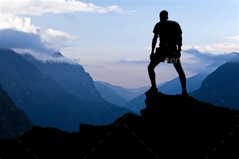 Man hiking success silhouette in mountains Stock Photo by blas | PhotoDune