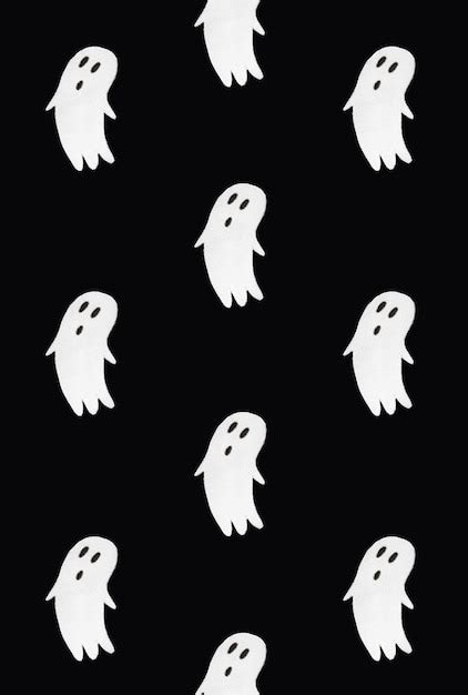 Premium Photo | Horror pattern made of ghosts on black background ...