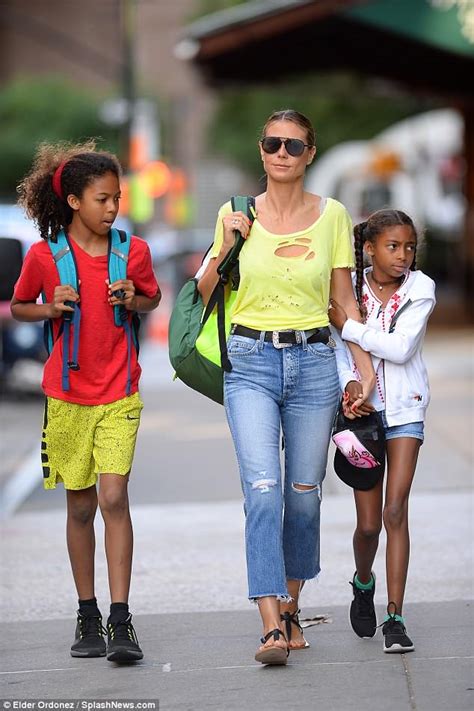 Heidi Klum looks lovely in a lemon top and jeans in NYC with children | Daily Mail Online