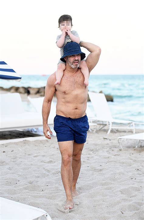 Andy Cohen Reveals Toned Abs While On Vacation With Son Benjamin ...