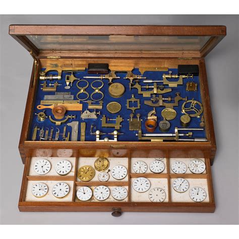 Wow !!! A MAHOGANY DISPLAY CABINET OF WATCHMAKER'S TOOLS, CIRCA 1890 including calipers, jacot ...