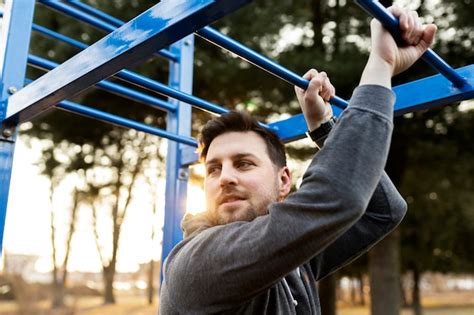 Free Photo | Young man exercising outdoors in the park