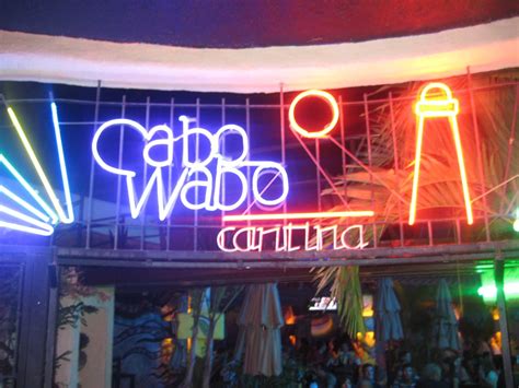 the neon sign above the restaurant says patio wabe