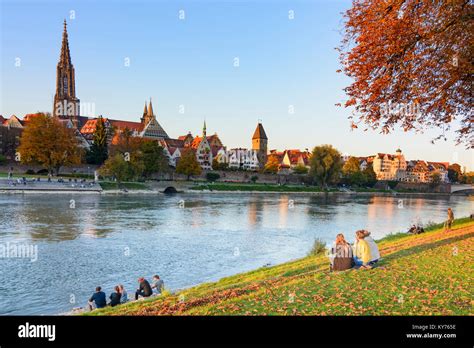 Ulm: river Donau (Danube), church Münster Ulm Minster, people, Schwäbische Alb, Swabian Alb ...