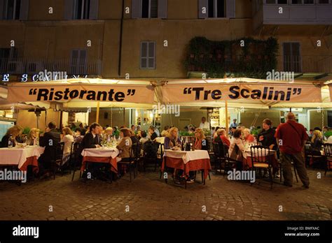 Typical restaurant pizzeria "Tre Scalini" with people eating in the Stock Photo: 29853444 - Alamy