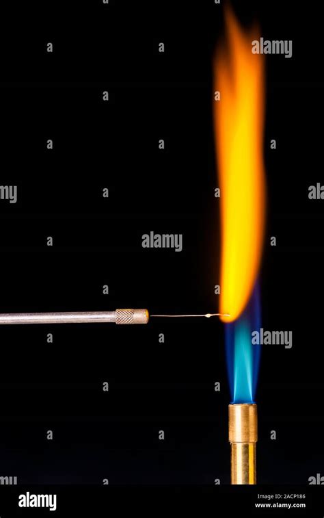 Sodium flame test. Positive result of a flame test for sodium (Na ...