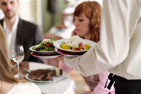 «Waiter Serving Food At The Restaurant» del colaborador de Stocksy ...