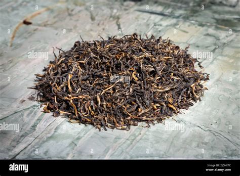 Pu-erh fermented Chinese tea in a roll Stock Photo - Alamy