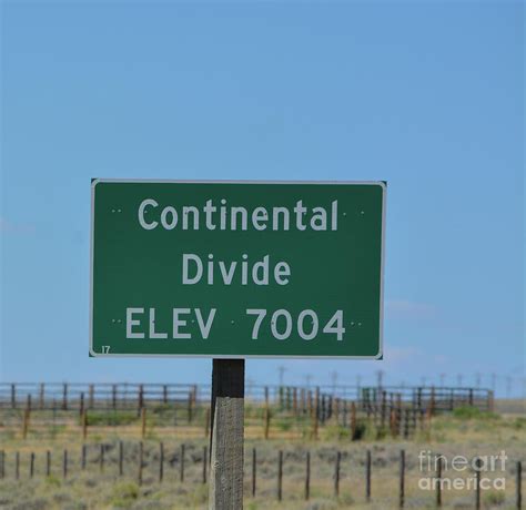 The Continental Divide sign also known as Western Divide in the Rocky Mountains of Wyoming ...