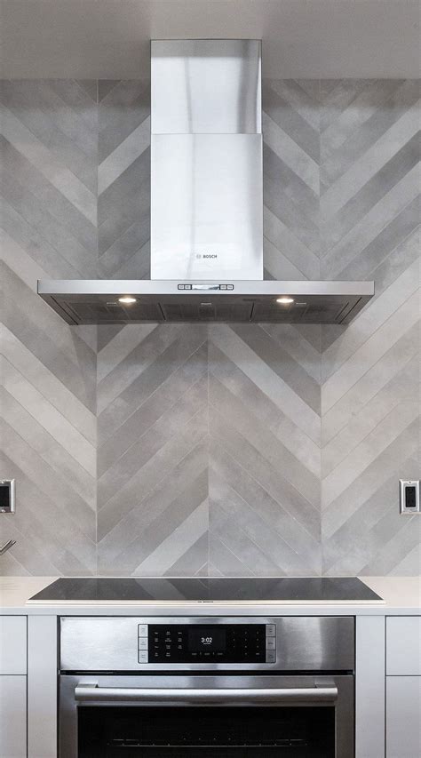 91872 contemporary black and white kitchen with gray chevron backsplash close up Chevron Tile ...