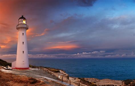 Wallpaper sea, sunset, lighthouse images for desktop, section пейзажи - download