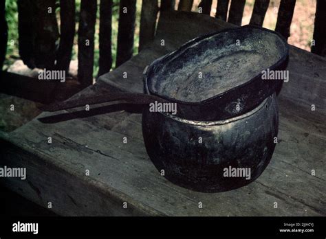 Skillet and cooking pot inside modern typical Mayan house at Dzibilchaltun Museum and ruins ...