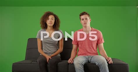 Boring couple staring at the camera on a futon couch on green screen Stock Footage,#camera#futon ...