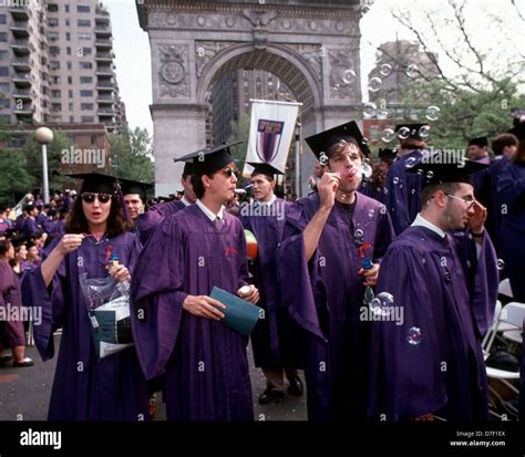 New York University graduates cavort in Washington Square Park during the NYU commencement ...