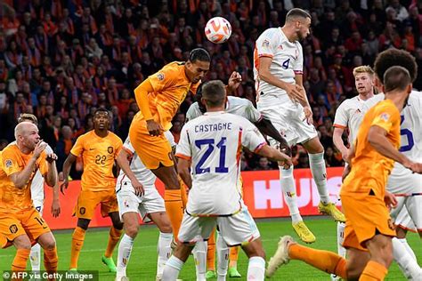 Virgil van Dijk's 73rd minute header seals top spot and an unbeaten finish for Holland in Group ...