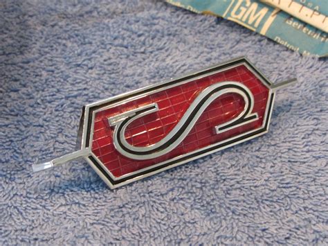 NOS Trunk Lid "S" Emblem 1968 Olds Cutlass Convertible - ClassicOldsmobile.com