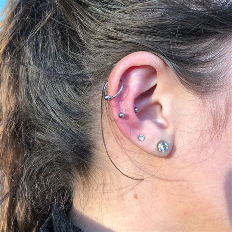 Here’s everything you need to know about the “snug piercing” that everyone’s getting in 2018 ...