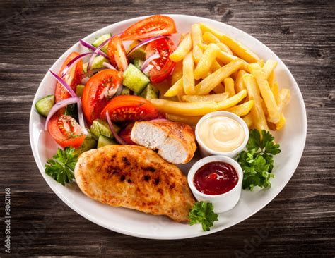 "Fried chicken fillet, chips and vegetable salad" Stock photo and royalty-free images on Fotolia ...