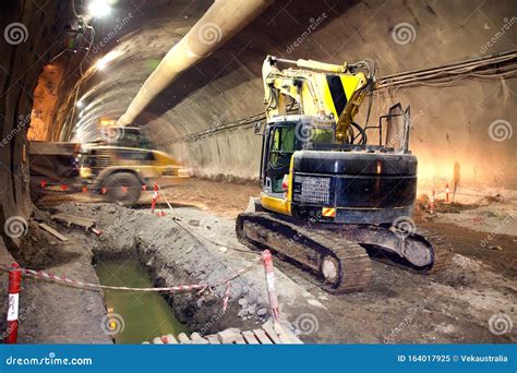 Concrete Road Tunnel Construction Excavator and Dump Truck Stock Image ...