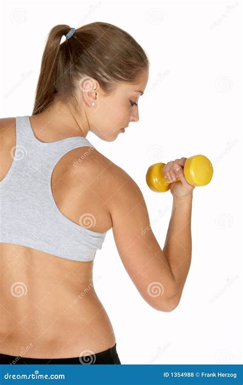 Young Woman Looking at Bicep Curl Stock Photo - Image of gray, calories ...